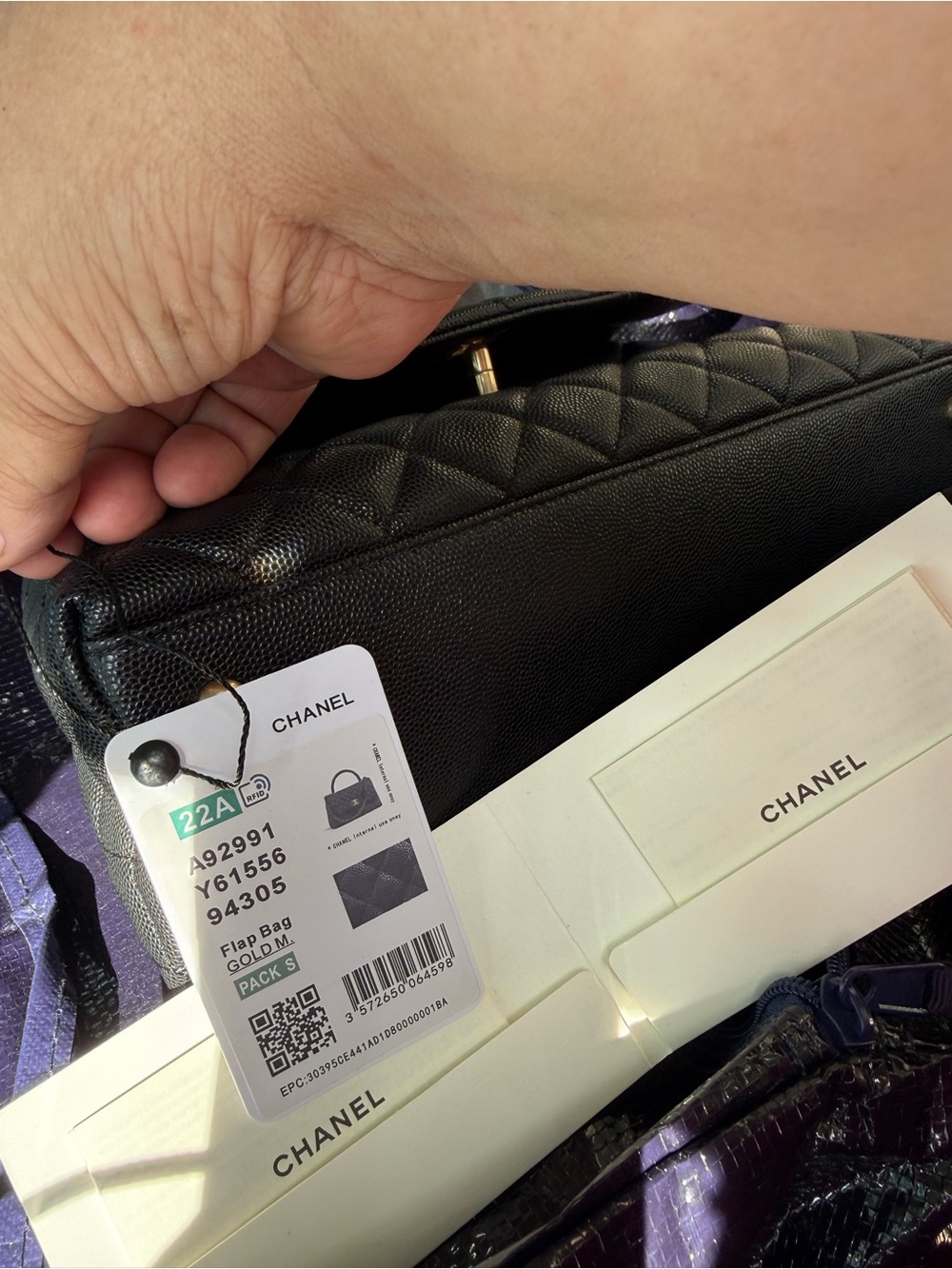CHANEL Black Quilted Flap Bag with Gold Hardware